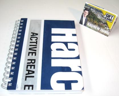 Recycled coreflute notebook made from a Harcourts sign to create a souvenir of the sale for the vendor.